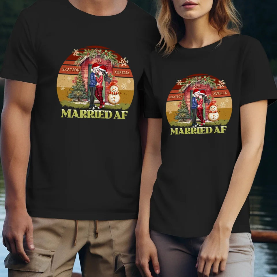 Couple Hugging In Front Of Christmas Decorated House - Custom Name - Personalized Gift For Couples - Unisex T-Shirt