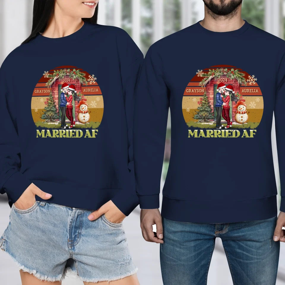 Couple Hugging In Front Of Christmas Decorated House - Custom Name - Personalized Gift For Couples - Unisex Sweater