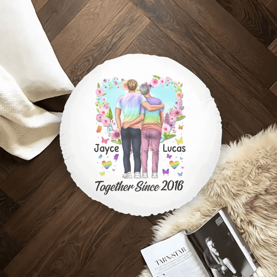Celebrating love, a gay couple shares a tender hug on a personalized pillow embellished with flowers - a perfect gift for Valentine's or anniversary.